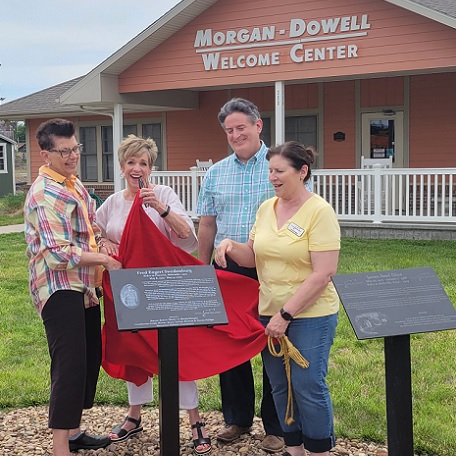 Susan Sutton, Linda Houser, and Brenton and Wonda Phillips Helped Unveil Two New Plaques in the Courtyard at the National Orphan Train Complex on Thursday, June 1st