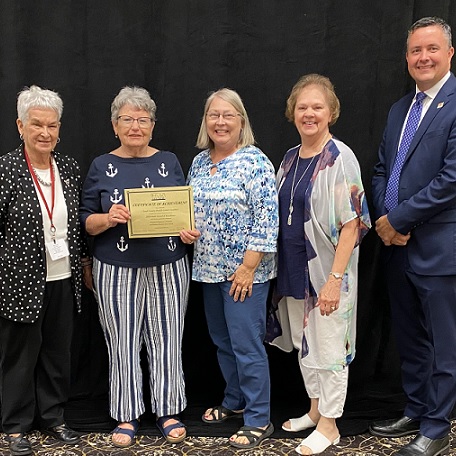 Sally Emerson, HVK President, Presents the Gold Award to NCKMC Volunteers – Shirley Moynihan, Marie Cairns, and Pam Campbell. Chad Austin, KHA President, Congratulates the Volunteers