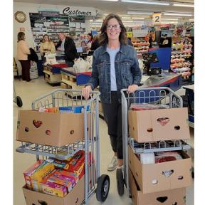 Kim Muff Won a Five-Minute Grocery Grab Shopping Spree in Rod's Food Store in the Rotary Club of Concordia's Annual Grocery Grab on Thursday, March 21st